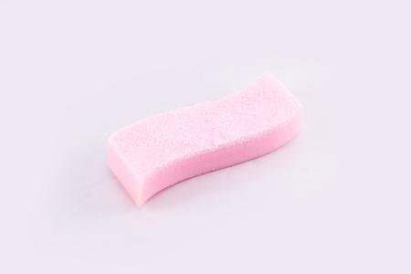 Pink Dishwashing sponge on a white background .の写真素材