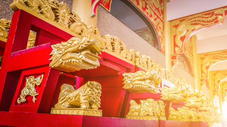 ancient Chinese dragon red chair wooden carving with luxurious material .の写真素材