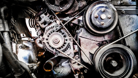 Car engine. Metallic background of the internal combustion a fragment of the old engine motor.の写真素材