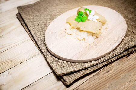 Thai traditional dessert sticky rice Thai custard On a wooden tray Recommended dishes in Thailand.の写真素材