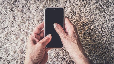 Senior older hands woman Using Smart Phone .の写真素材