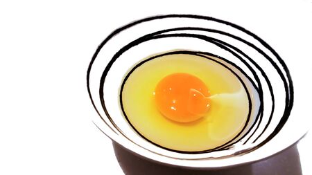 Raw eggs in a Customizable design bowl .の写真素材