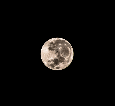 Full moon biggest at night isolated on black background.の写真素材