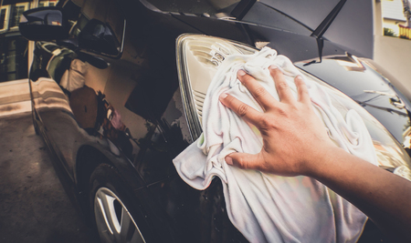 cleaning car with fabric cloth . Customize colors Vintage retro and old film Toneの写真素材