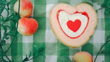 heart shaped shortbread valentine cookies . homemade cake In the form of heart with Stuffed jam blueberries and strawberries top view close upの写真素材