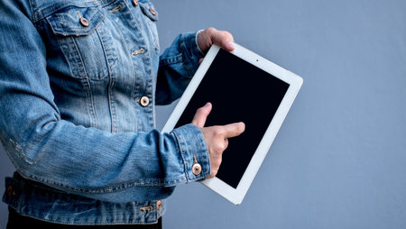 Attractive Modern business woman Hand Touching and Using Digital tablet Screen . Analyst Department...