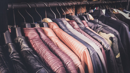 Collection of leather jackets on hangers in the shop for biker's or motorcycle jackets.の写真素材