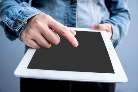 Attractive Modern business woman Hand Touching and Using Digital tablet Screen . Analyst Department Researching Process . Young Girl Working New Startup .の写真素材