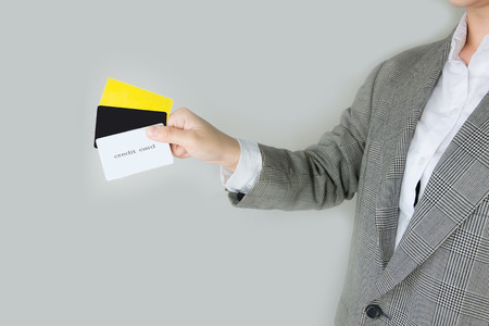 businessman Hands holding Credit card or black label  in office .の写真素材