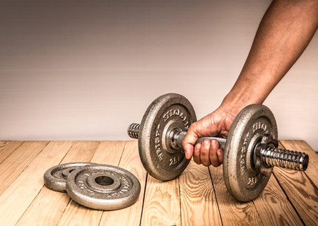 hand taking dumbbell for bodybuilder. Concept for sport player or workout. gym of accessories for fitnessの写真素材
