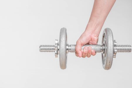 hand taking dumbbell for bodybuilder. Concept for sport player or workout. gym of accessories for fitnessの写真素材