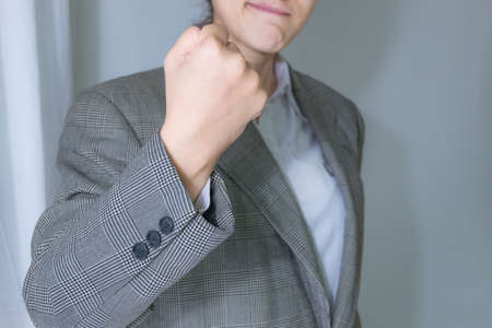 Happy smiling business woman making motion hands of confidence  . admire office good and success conceptの写真素材