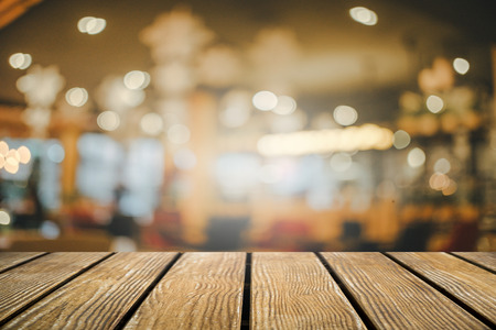 Empty Old Wooden table with Restaurants Or the coffee shop background .の写真素材