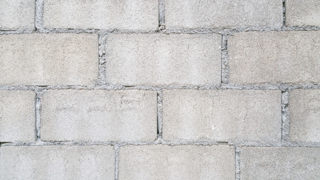 Brickwork or cement brick wall backgroundの写真素材