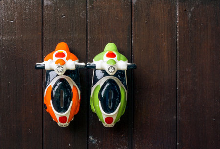 a toy car made of ceramic, put on a dark brown background の写真素材