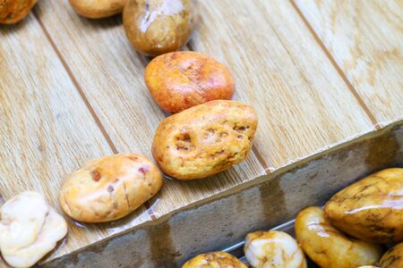 abstract of gravel on the wood near swimming pool.の写真素材