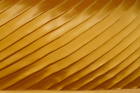 gold texture background on the back of buddha statue in templeの写真素材