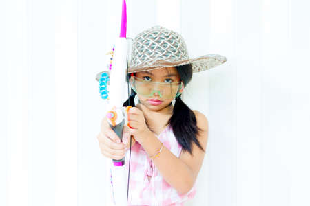 fashion Model girl over background. Beauty stylish cute girl posing in fashionable clothes and sunglasses. High fashion urban styleの写真素材