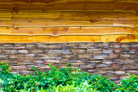 wall background with the flower at the front and stone wall connected with wood wall