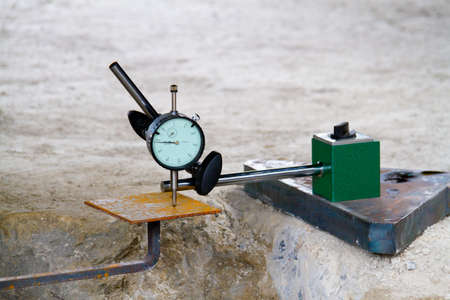 Dial gauge and with Magnetic base checking on steel plates for engineer inspector or analyzeの写真素材