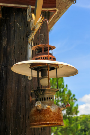 Old lantern hang on woodの写真素材