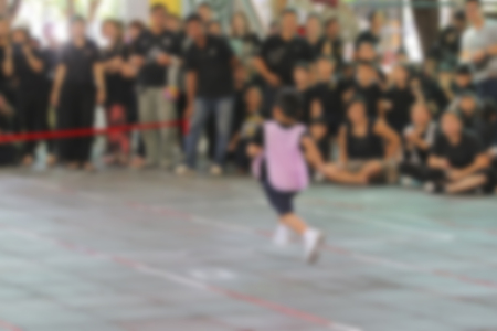Blurry of young boy running to win the raceの写真素材