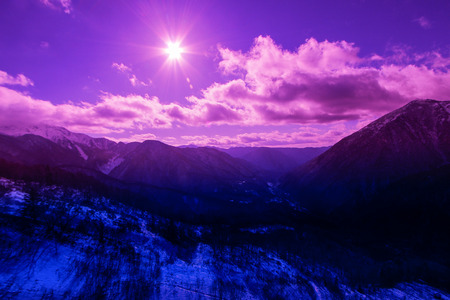 landscape of mountain covered with snow with the beautiful cloud and sky background.JAPANの写真素材