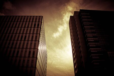 Silhouette of architecture with window building pattern with the reflection of sky for background .の写真素材