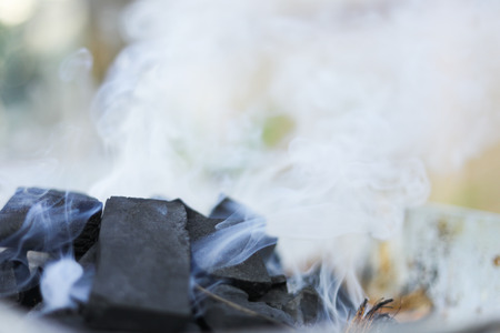 Smoke from burning charcoalの写真素材