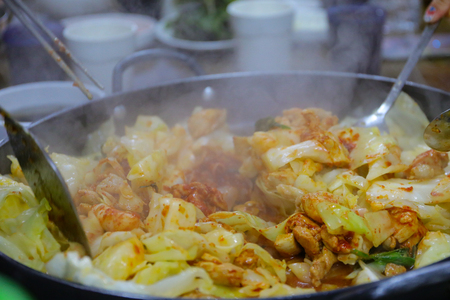 Dakgalbi : One of Korean favorite : Korean spicy stir fried vegetable, chicken and Korean spicy sauce (Gochujang) in big hot pan.の写真素材