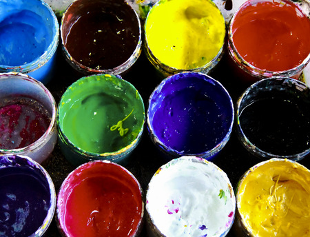 Close up of oil paint inside plastic containerの写真素材