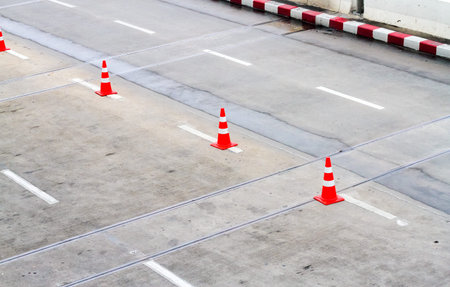 Red cones arranged in the street for Traffic.