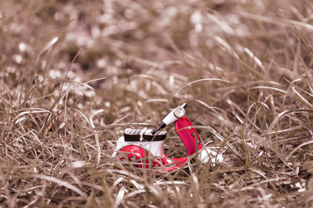 mini motorbike  alone on grass vintage styleの写真素材