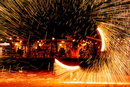 fire dance on beach near the sea , the east coast of thailand