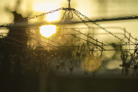 clothespins hanging on a clothesline : abstract backgroundの写真素材