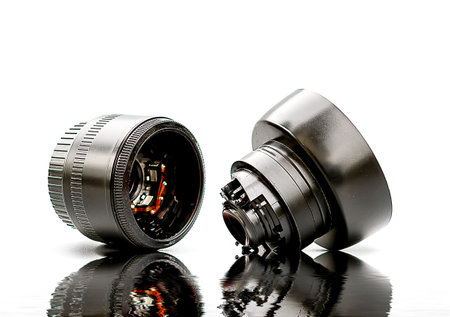 broken camera lens on white background