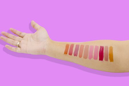 Lipstick swatches on woman handの写真素材