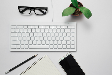 Top view Business desk, marketing and lifestyle white backgroundの写真素材