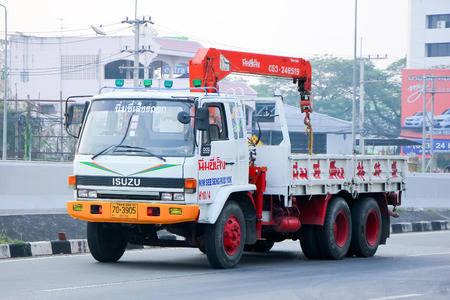 CHIANGMAI , THAILAND - APRIL 20 2014  Truck with crane of Nim See Seng Transport 1988 company   Photo at Road No 11 about 2 Km from Chiangmai city  のeditorial素材
