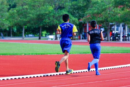 CHIANGMAI, THAILAND- -JULY 12 2014  Young Football Player runing  Player of CHIANGMAI FOOTBALL CLUB 700 YEAR  Photo at Mini football field of 700 Year Main Stadium,Chiangmai   thailand のeditorial素材