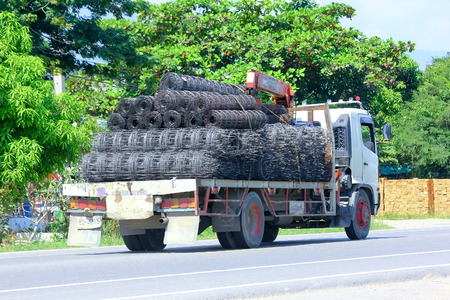 Chiangmai, Thailand - October 3, 2014: Truck with crane of Muangnuetakranlek company. Photo at road no 121 about 8 km from downtown Chiangmai, thailand.のeditorial素材
