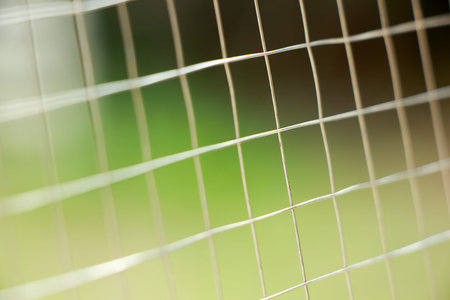 Metal net fence backgroundの写真素材