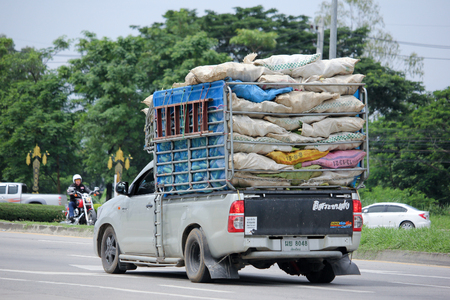 CHIANGMAI, THAILAND -AUGUST 20 2015: Private cargo truck. Photo at road no.1001 about 8 km from downtown Chiangmai, thailand.のeditorial素材
