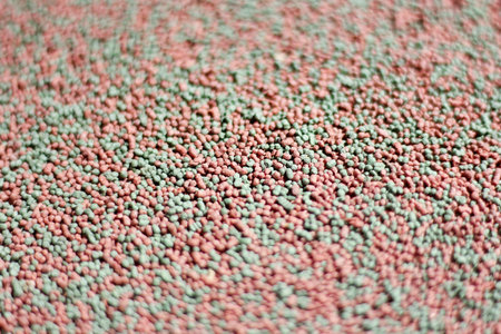 Closeup of Pet Food, Small of Green mix red fish food.