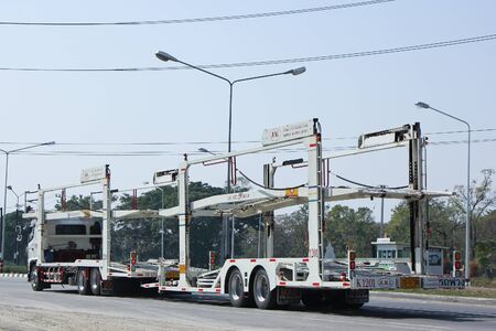 CHIANGMAI, THAILAND -FEBRUARY 4 2016:  ANI Logistics Group carrier trailer Truck for Honda car.   On road no.1001, 8 km from Chiangmai city.のeditorial素材