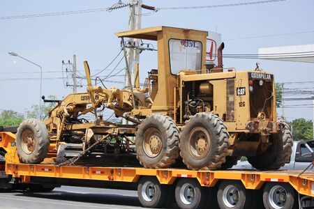 CHIANGMAI, THAILAND -MAY 28 2016: Catterpillaer Road grader on Trailer truck. Photo at road no.1001 about 8 km from downtown Chiangmai, thailand.のeditorial素材