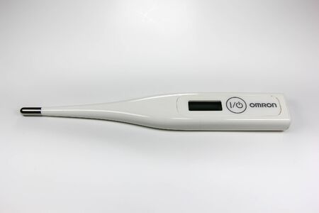 CHIANGMAI, THAILAND -JULY 2 2016: Product shot of White Omron Digital Thermometer.のeditorial素材