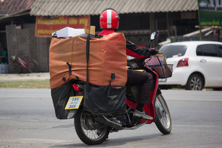 CHIANG MAI, THAILAND -APRIL 23 2017: Postman and Motercycle of Thailand Post. Photo at road no.121 about 8 km from downtown Chiangmai, thailand.のeditorial素材