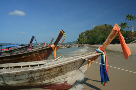 KRABI, THAILAND- MARCH 17 2009: Longtail ship at Ao nang beach. Longtail for travel to Phiphi island, Krabi. thailand.のeditorial素材