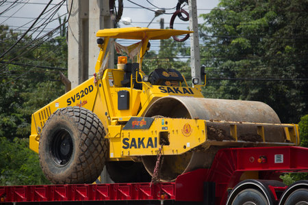 CHIANG MAI, THAILAND -SEPTEMBER 22 2017:  Trailer Dump Truck and Sakai Tire roller  of Payawan...